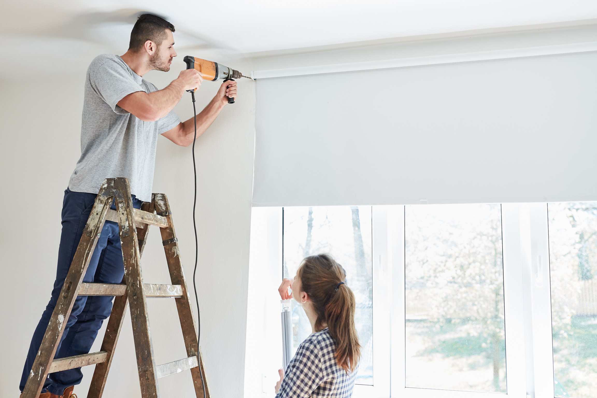 Handyman Assembling Window Roller Blind